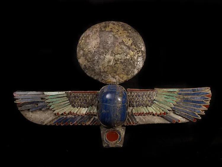 Ancient Egyptian winged scarab pendant with blue lapis lazuli and sun disk