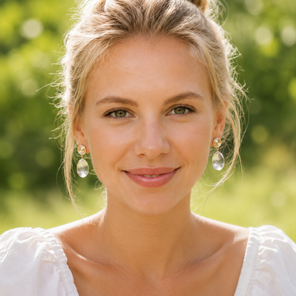 Woman with a bun hairstyle wearing earrings outdoors