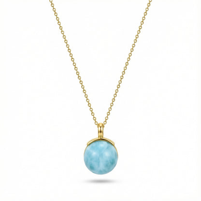 Gold chain necklace with round larimar pendant featuring ocean-like blue stone